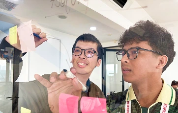 Developers working together on a coding task