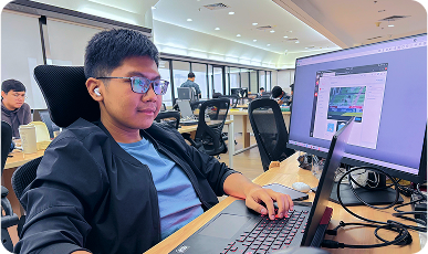 Someone working on a laptop in a cozy office